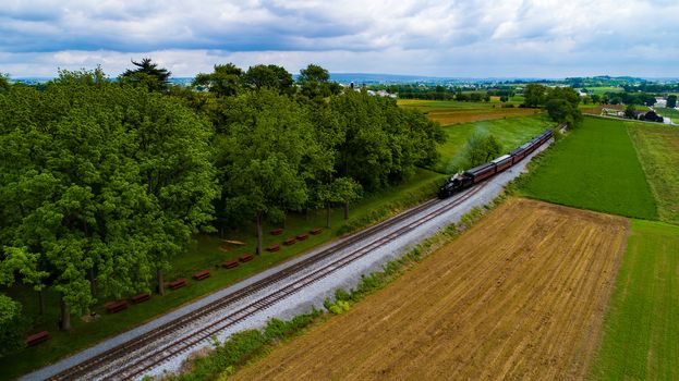 Ariel View Waiting for Steam Train with Passenger Cars on a Sunny Summer Day as seen by a Drone Ariel View Waiting for Steam Train with Passenger Cars on a Sunny Summer Day as seen by a Drone