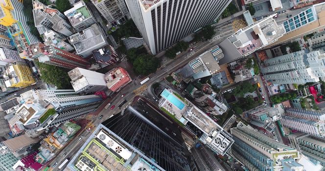 City Top View of Skyscrapers Building by drone Hong Kong city - Aerial view cityscape flying above Hong Kong City development buildings, energy power infrastructure Financial and business center Asia