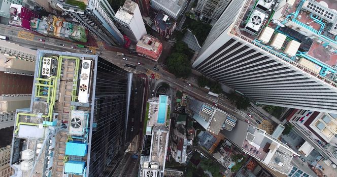 City Top View of Skyscrapers Building by drone Hong Kong city - Aerial view cityscape flying above Hong Kong City development buildings, energy power infrastructure Financial and business center Asia