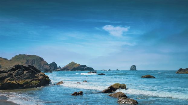 Aearial view of waves hitting the rocky. Beautiful nature image.