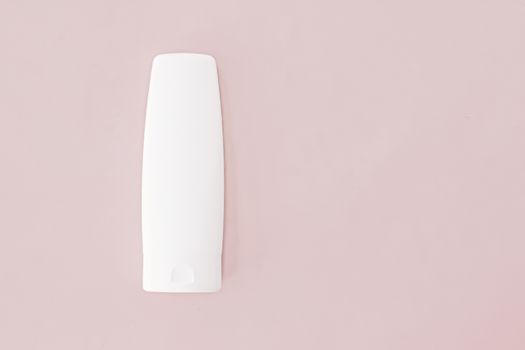 Moisturizing hand cream or body lotion on pink background, beauty product and skin care cosmetics, flatlay