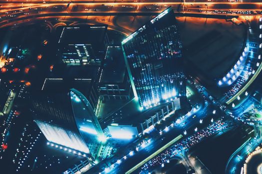 Aerial night view of Dubai in United Arab Emirates, metropolitan cityscape scenery