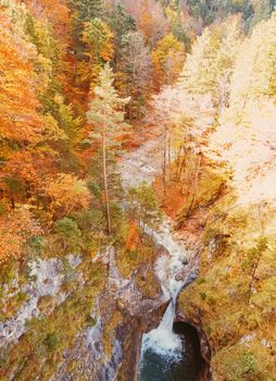 Beautiful nature of European Alps, landscape view of alpine mountains, lake and village in autumn season, travel and destination scenery