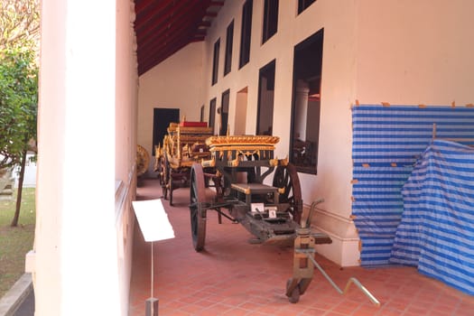 ancient cart in a buddhist temple territory in Bangkok city, Thailand