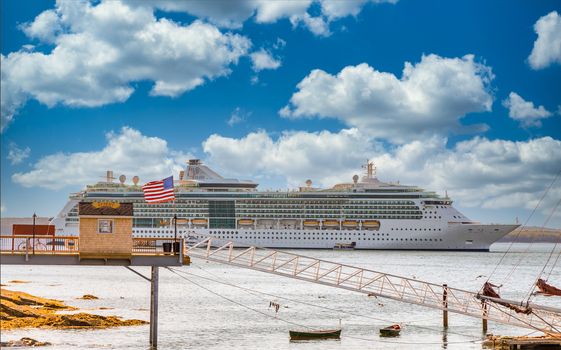 Luxury Cruise Ship by Ticket Booth on New England Shore