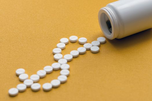 tablet bottle of medicine, photo isolated on a yellow background. Mock-up.