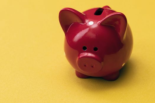 Pink piggy bank on color background. Money saving