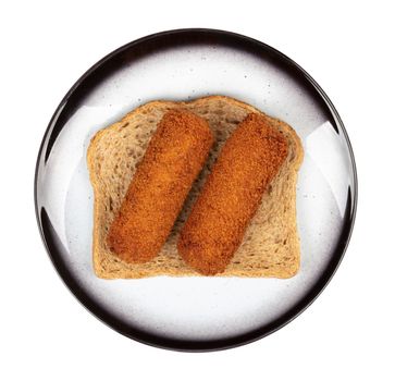 Brown crusty dutch kroketten on a piece of bread, isolated on a white background