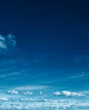 Bright blue sky with clouds, nature and environmental background