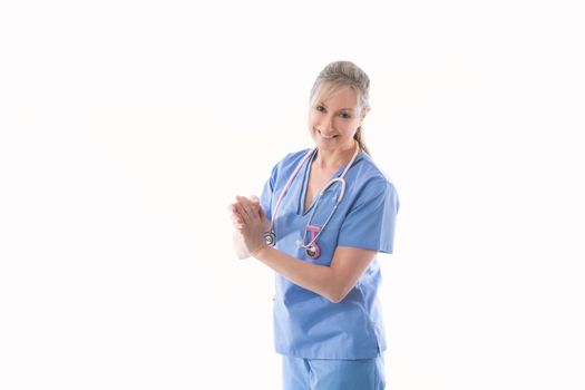 Friendly caring nurse using or demonstrating an alcohol hand sanitizer for hand hygiene
