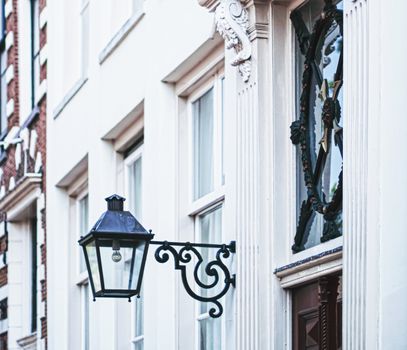 Architectural detail of a building on the main city center street of Amsterdam in Netherlands, european architecture