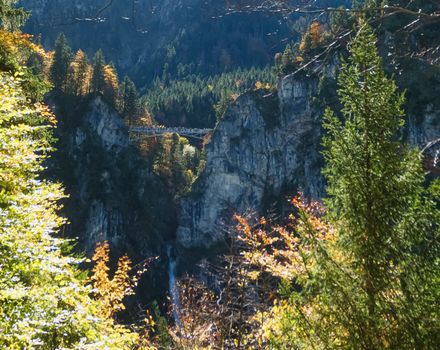 Beautiful nature of European Alps, landscape view of alpine mountains, lake and village on a sunny day, travel and destination scenery