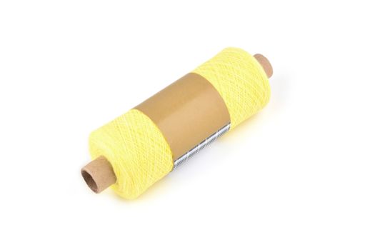 Color bobbin of yarn with label. Side view. Textile reel on isolated white background. Use for store