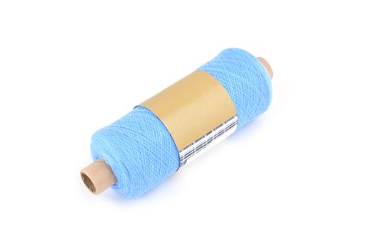 Color bobbin of yarn with label. Side view. Textile reel on isolated white background. Use for store