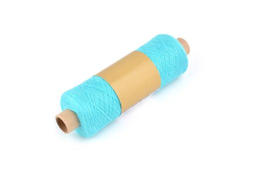 Color bobbin of yarn with label. Side view. Textile reel on isolated white background. Use for store