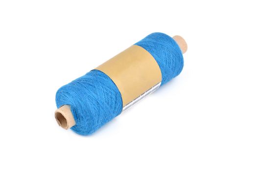 Color bobbin of yarn with label. Side view. Textile reel on isolated white background. Use for store