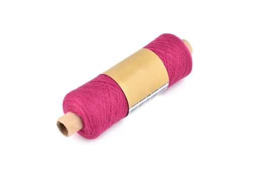 Color bobbin of yarn with label. Side view. Textile reel on isolated white background. Use for store