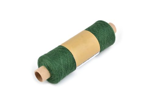 Color bobbin of yarn with label. Side view. Textile reel on isolated white background. Use for store