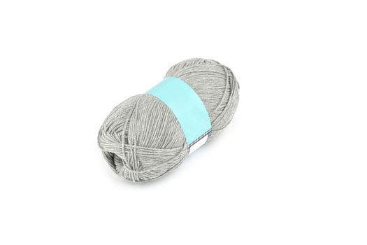 Tangle of color yarn with blank label on white background skein. Knitting isolated on white. Use for store