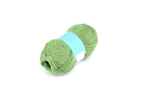 Tangle of color yarn with blank label on white background skein. Knitting isolated on white. Use for store