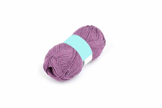 Tangle of color yarn with blank label on white background skein. Knitting isolated on white. Use for store