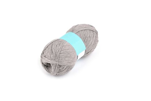 Tangle of color yarn with blank label on white background skein. Knitting isolated on white. Use for store