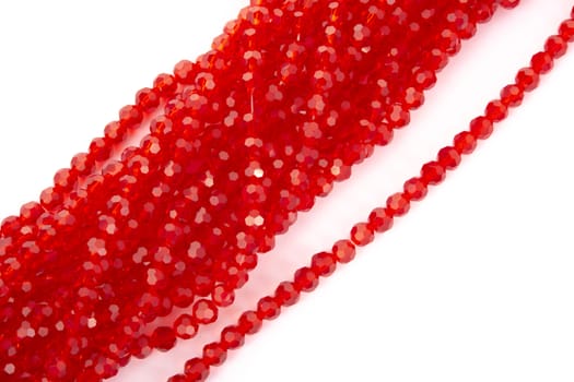 Beautiful Red Glass Sparkle Crystal Isoalted Beads on white background. Use for diy beaded jewelry