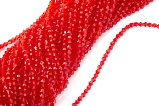 Beautiful Red Glass Sparkle Crystal Isoalted Beads on white background. Use for diy beaded jewelry