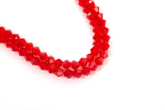 Beautiful Red Glass Sparkle Crystal Isoalted Beads on white background. Use for diy beaded jewelry