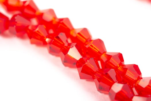 Beautiful Red Glass Sparkle Crystal Isoalted Beads on white background. Use for diy beaded jewelry