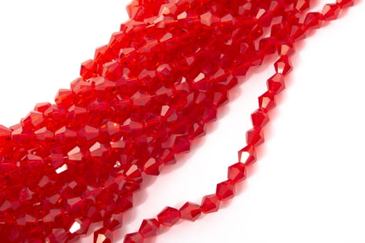 Beautiful Red Glass Sparkle Crystal Isoalted Beads on white background. Use for diy beaded jewelry