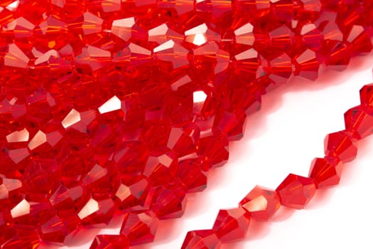 Beautiful Red Glass Sparkle Crystal Isoalted Beads on white background. Use for diy beaded jewelry