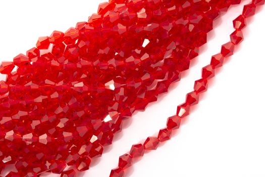 Beautiful Red Glass Sparkle Crystal Isoalted Beads on white background. Use for diy beaded jewelry