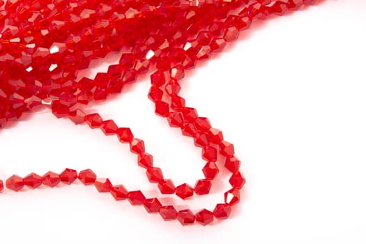 Beautiful Red Glass Sparkle Crystal Isoalted Beads on white background. Use for diy beaded jewelry