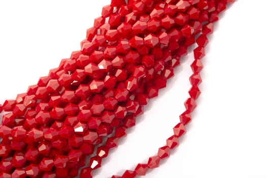 Beautiful Red Glass Sparkle Crystal Isoalted Beads on white background. Use for diy beaded jewelry