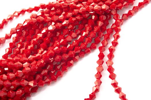 Beautiful Red Glass Sparkle Crystal Isoalted Beads on white background. Use for diy beaded jewelry
