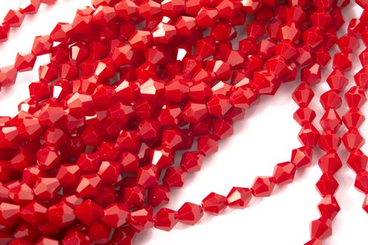Beautiful Red Glass Sparkle Crystal Isoalted Beads on white background. Use for diy beaded jewelry