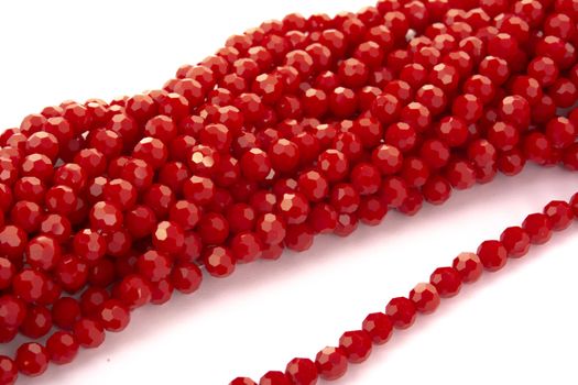 Beautiful Red Glass Sparkle Crystal Isoalted Beads on white background. Use for diy beaded jewelry
