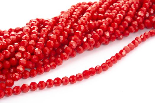 Beautiful Red Glass Sparkle Crystal Isoalted Beads on white background. Use for diy beaded jewelry