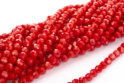 Beautiful Red Glass Sparkle Crystal Isoalted Beads on white background. Use for diy beaded jewelry