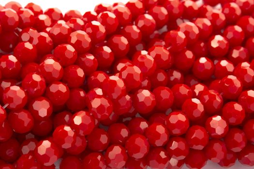 Beautiful Red Glass Sparkle Crystal Isoalted Beads on white background. Use for diy beaded jewelry