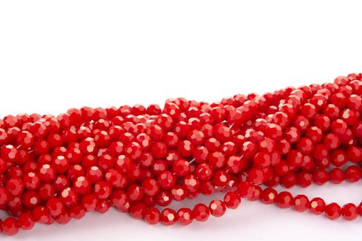 Beautiful Red Glass Sparkle Crystal Isoalted Beads on white background. Use for diy beaded jewelry