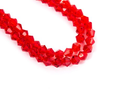 Beautiful Red Glass Sparkle Crystal Isoalted Beads on white background. Use for diy beaded jewelry