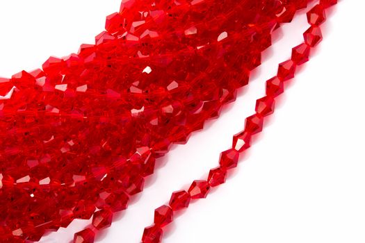 Beautiful Red Glass Sparkle Crystal Isoalted Beads on white background. Use for diy beaded jewelry