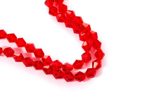 Beautiful Red Glass Sparkle Crystal Isoalted Beads on white background. Use for diy beaded jewelry