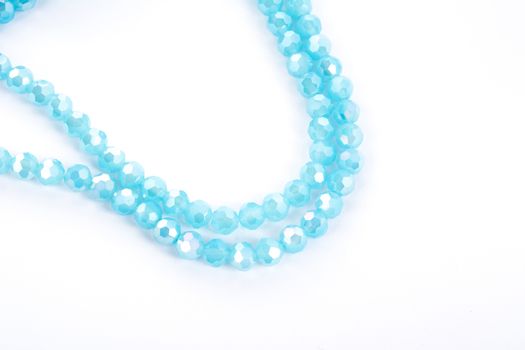 Beautiful Light Blue Glass Sparkle Crystal Isoalted Beads on white background. Use for diy beaded jewelry