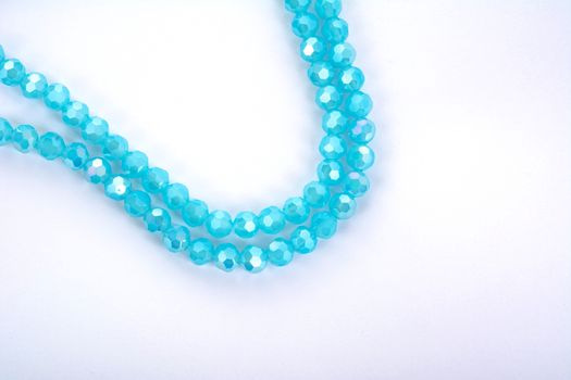 Beautiful Light Blue Glass Sparkle Crystal Isoalted Beads on white background. Use for diy beaded jewelry