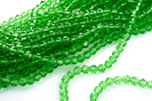 Beautiful Light green Glass Sparkle Crystal Isoalted Beads on white background. Use for diy beaded jewelry