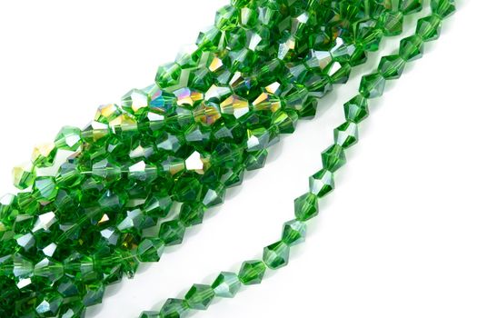 Beautiful Light green Glass Sparkle Crystal Isoalted Beads on white background. Use for diy beaded jewelry