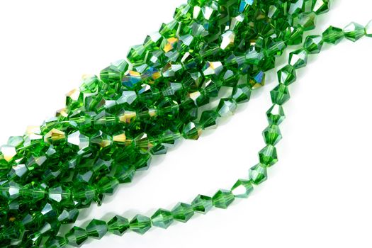 Beautiful Light green Glass Sparkle Crystal Isoalted Beads on white background. Use for diy beaded jewelry